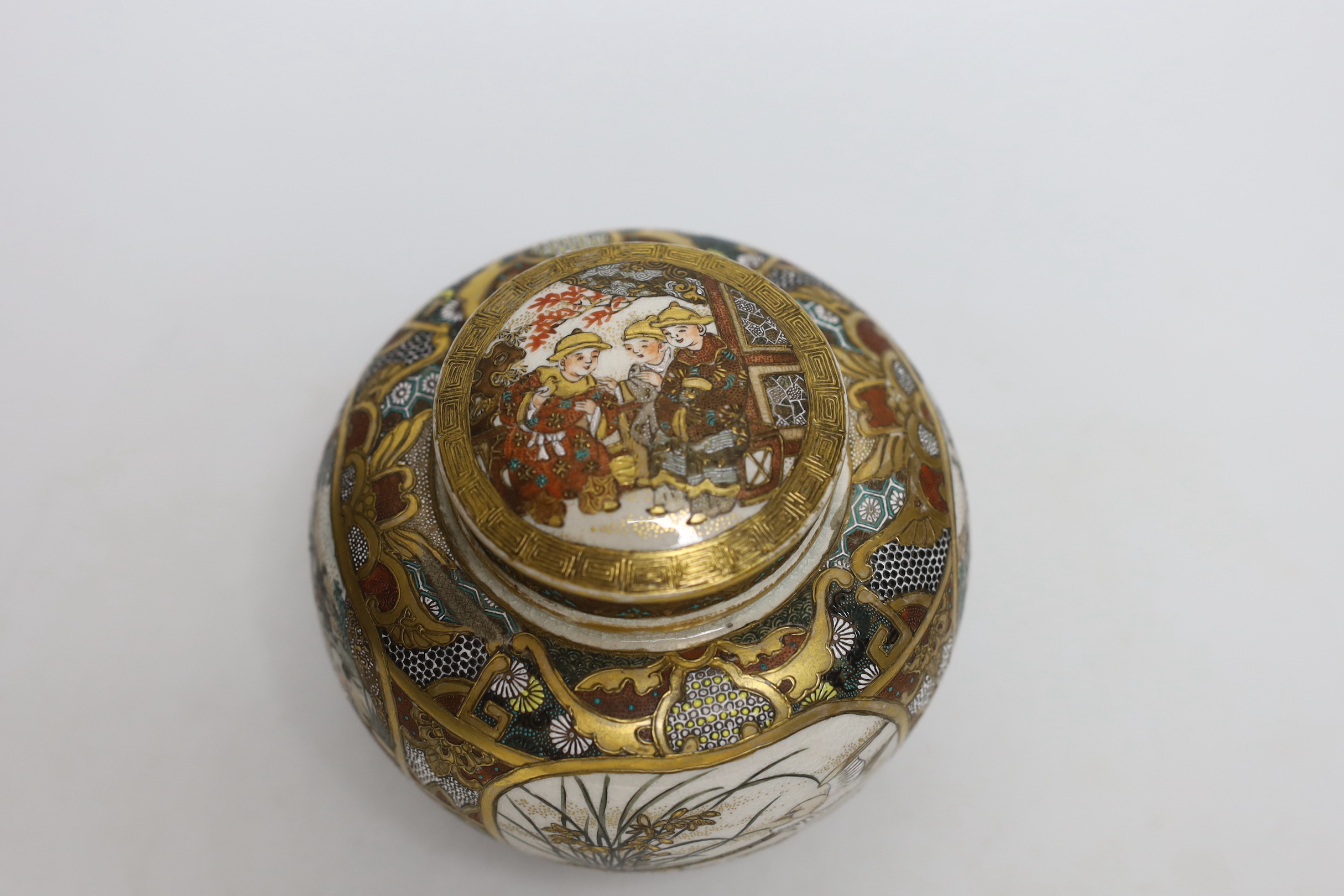 A Japanese Satsuma lidded jar and cover, 12cm high